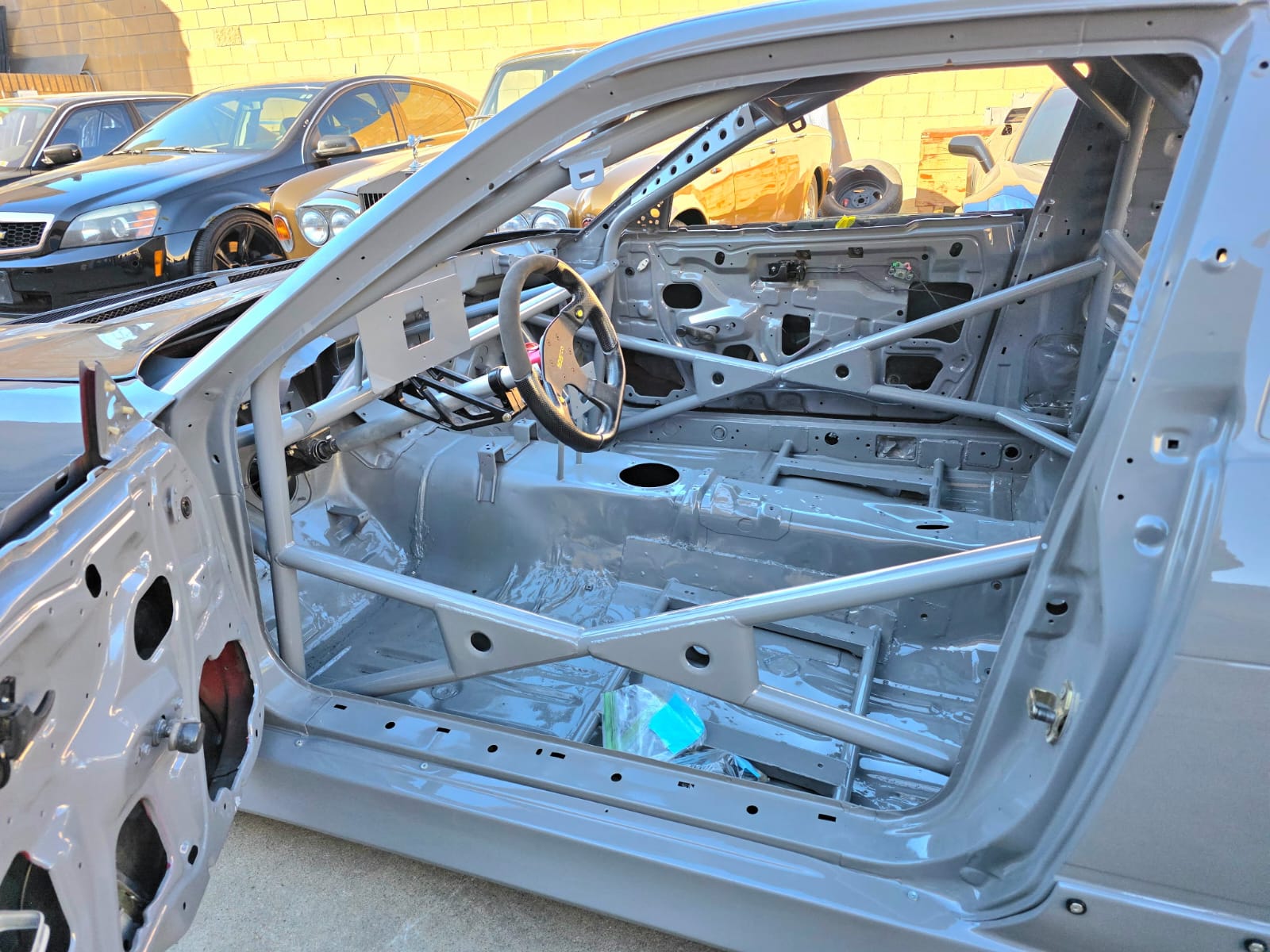 MotoIQ S13 racecar full roll cage interior view from rear