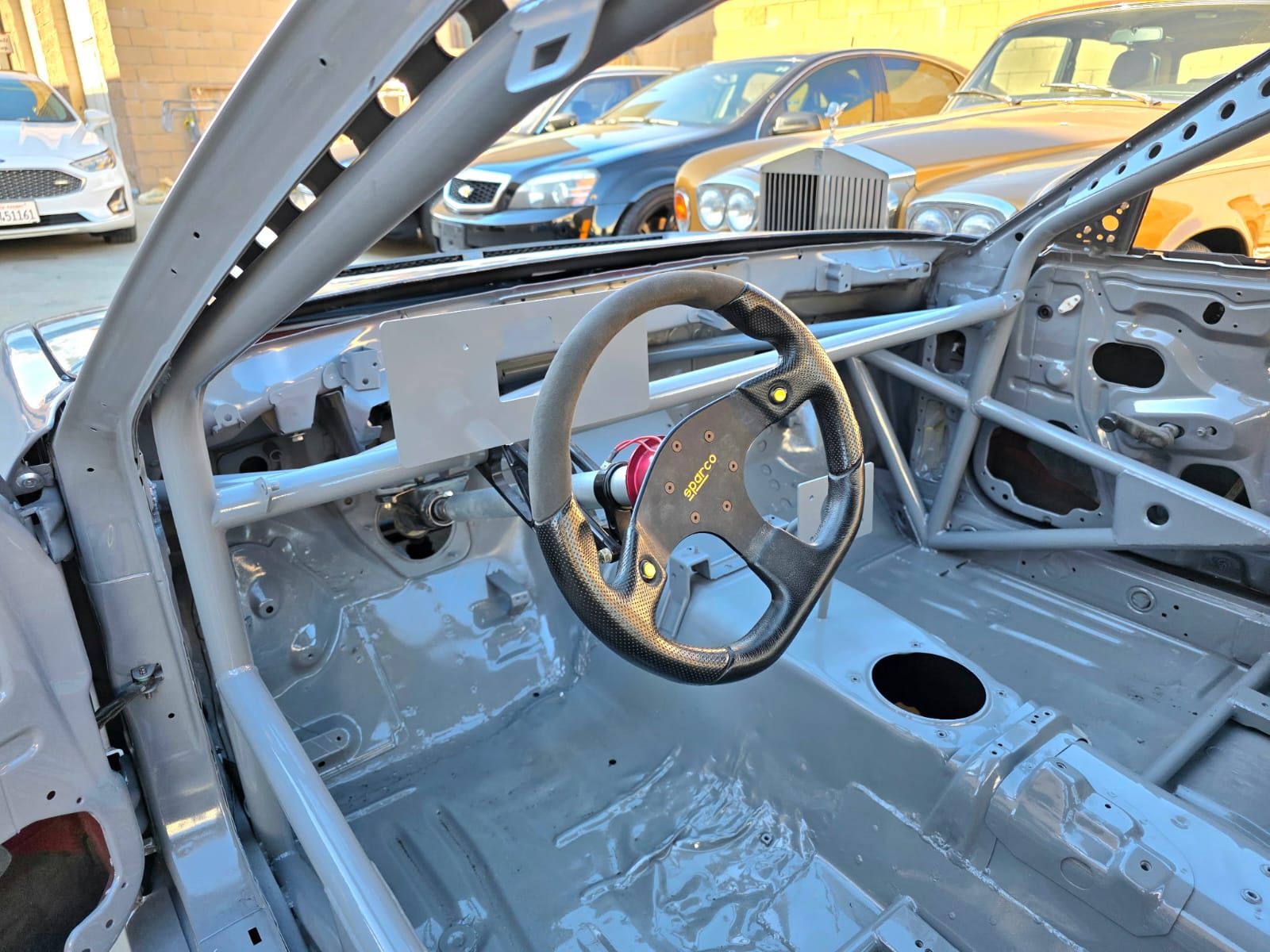 MotoIQ S13 racecar engine bay stripped and prepped