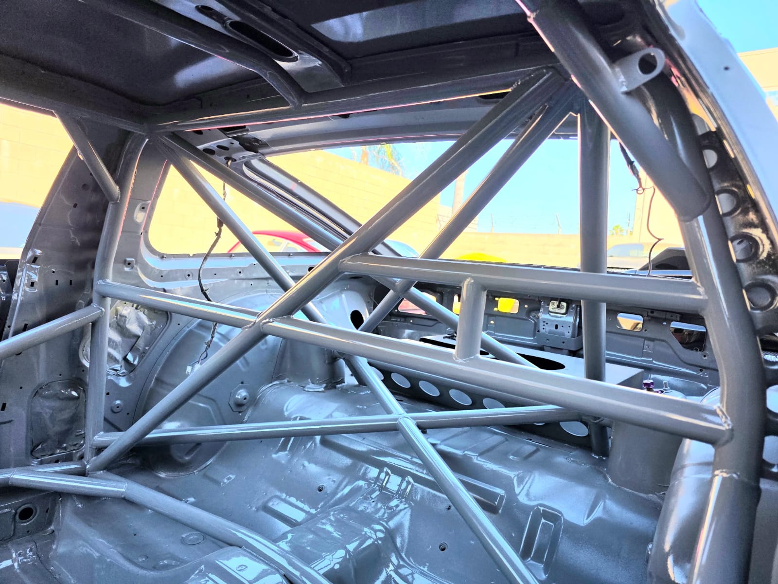 MotoIQ S13 racecar carbon fiber hood with vents close-up