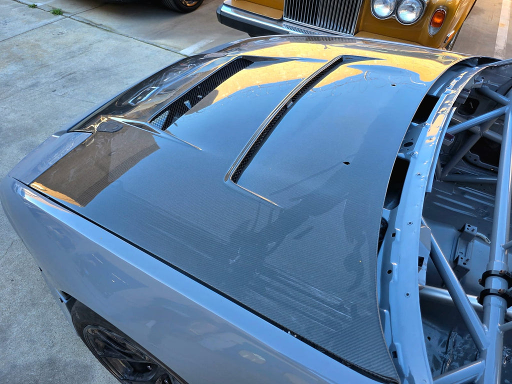 MotoIQ S13 racecar suspension tower detail with titanium hardware