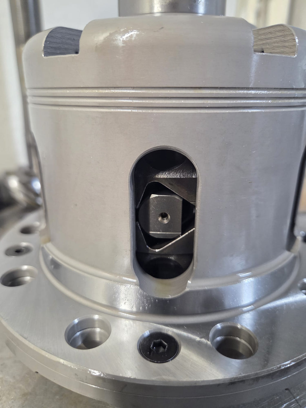 Cusco LSD with rebuild kit components and axle shafts on welding table