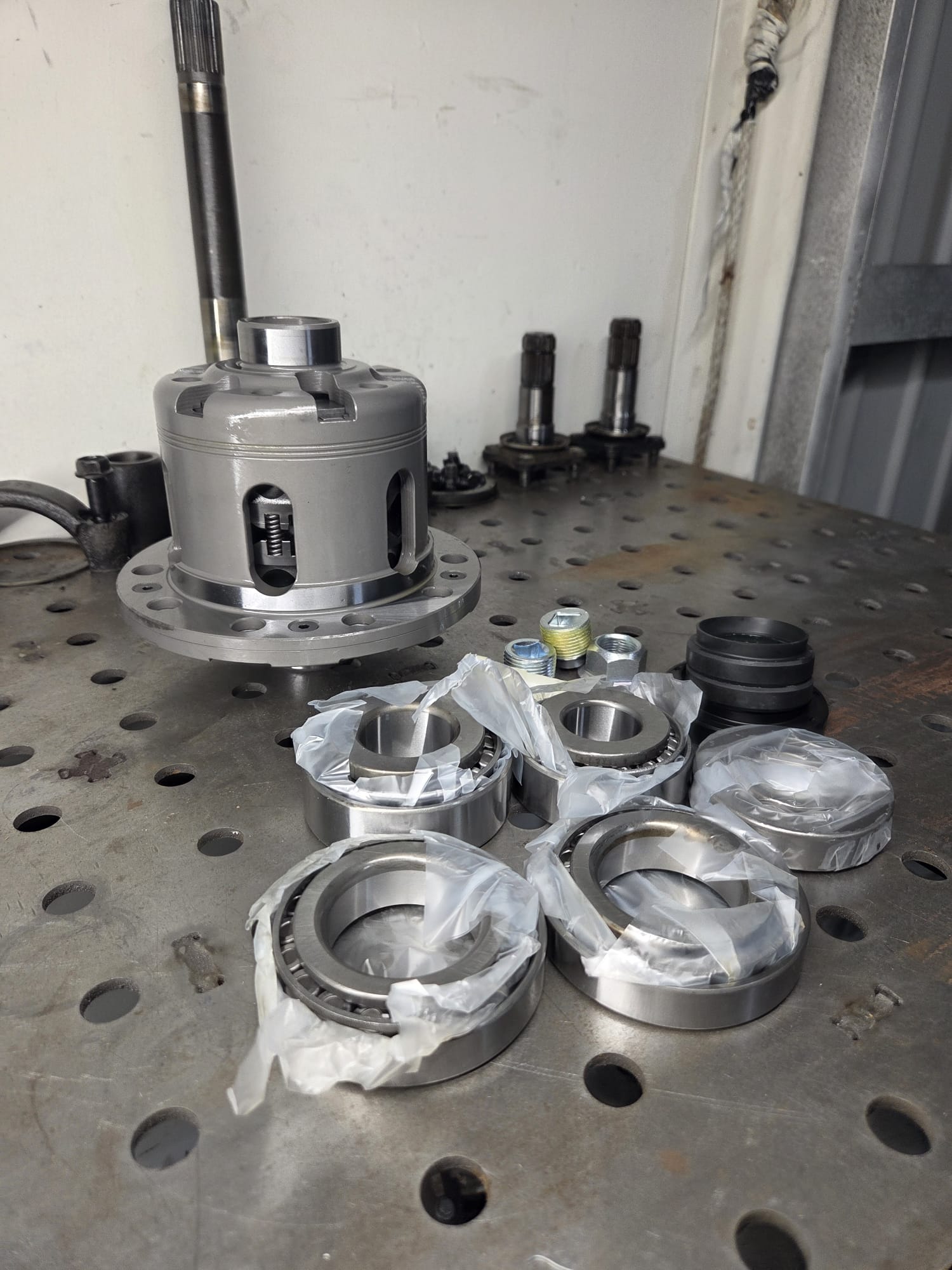 Cusco LSD differential with rebuild kit components on welding table