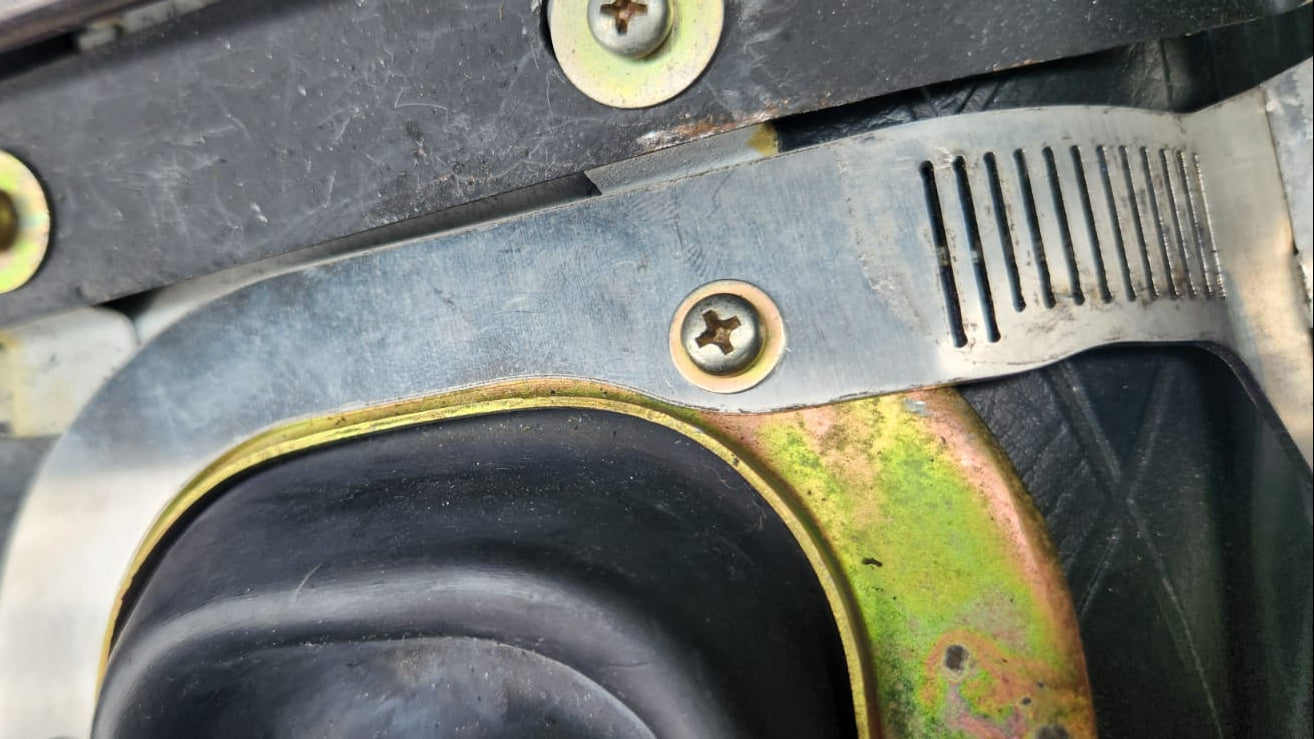 Cup holder mounted next to shifter boot