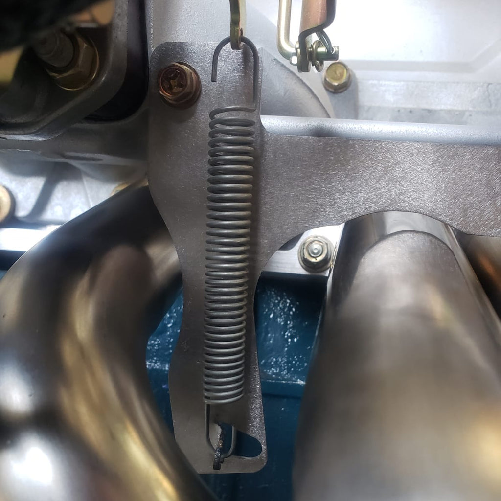 L6 Return Spring Bracket - Mount Under Stock Heatshield